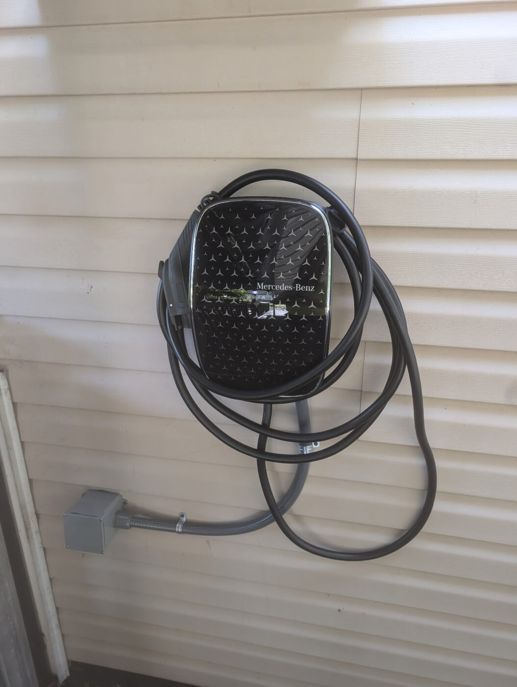 Mercedes-Benz home charger mounted with conduit run