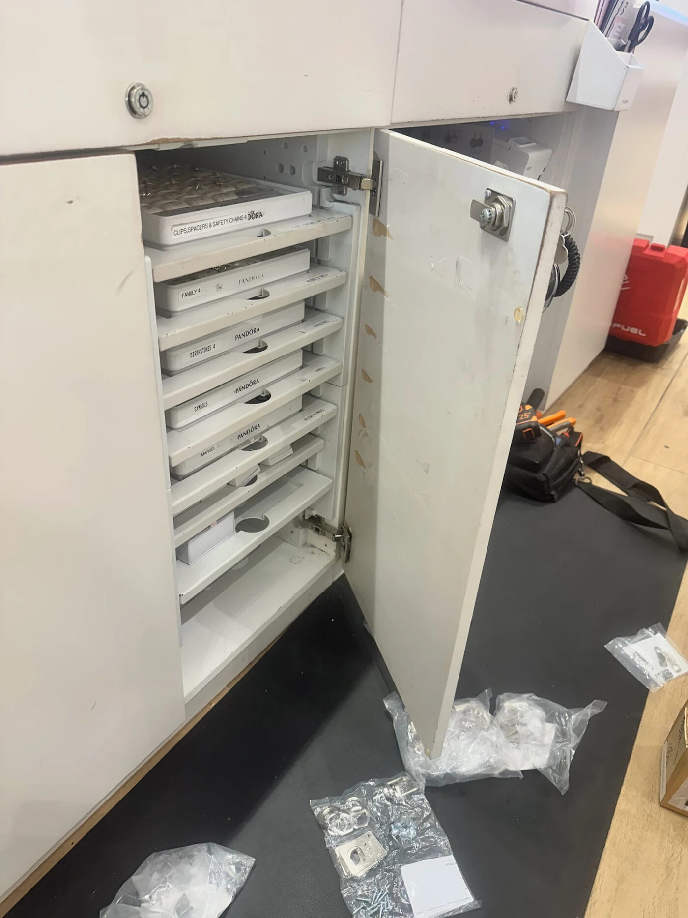 Retail display cabinet hinges and locks rebuilt in-store