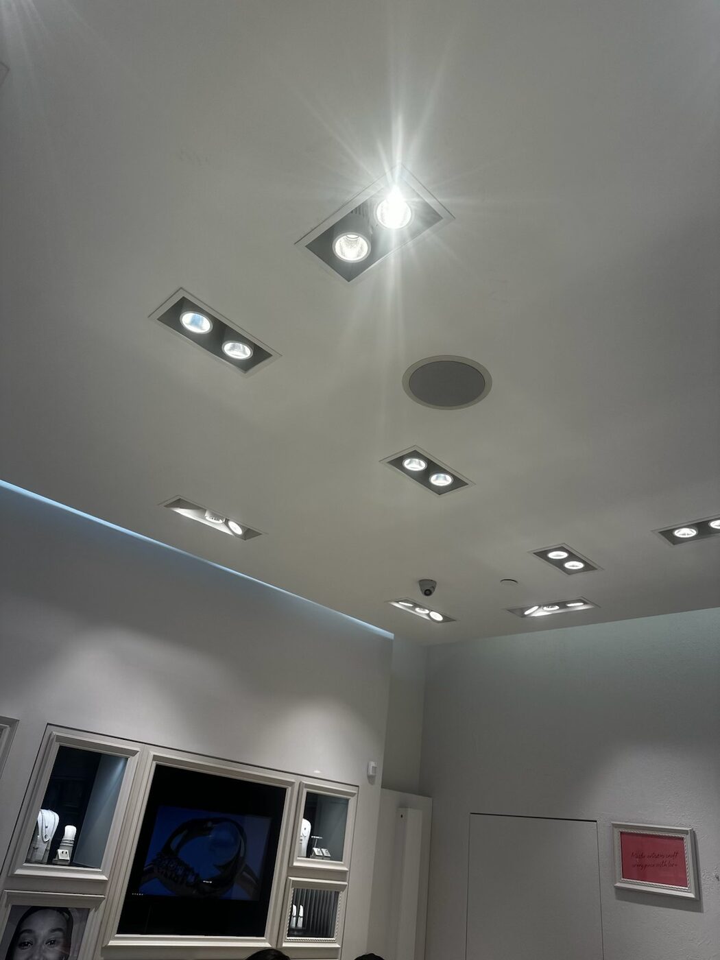 Recessed retail spotlights re-lamped and aimed across the sales floor