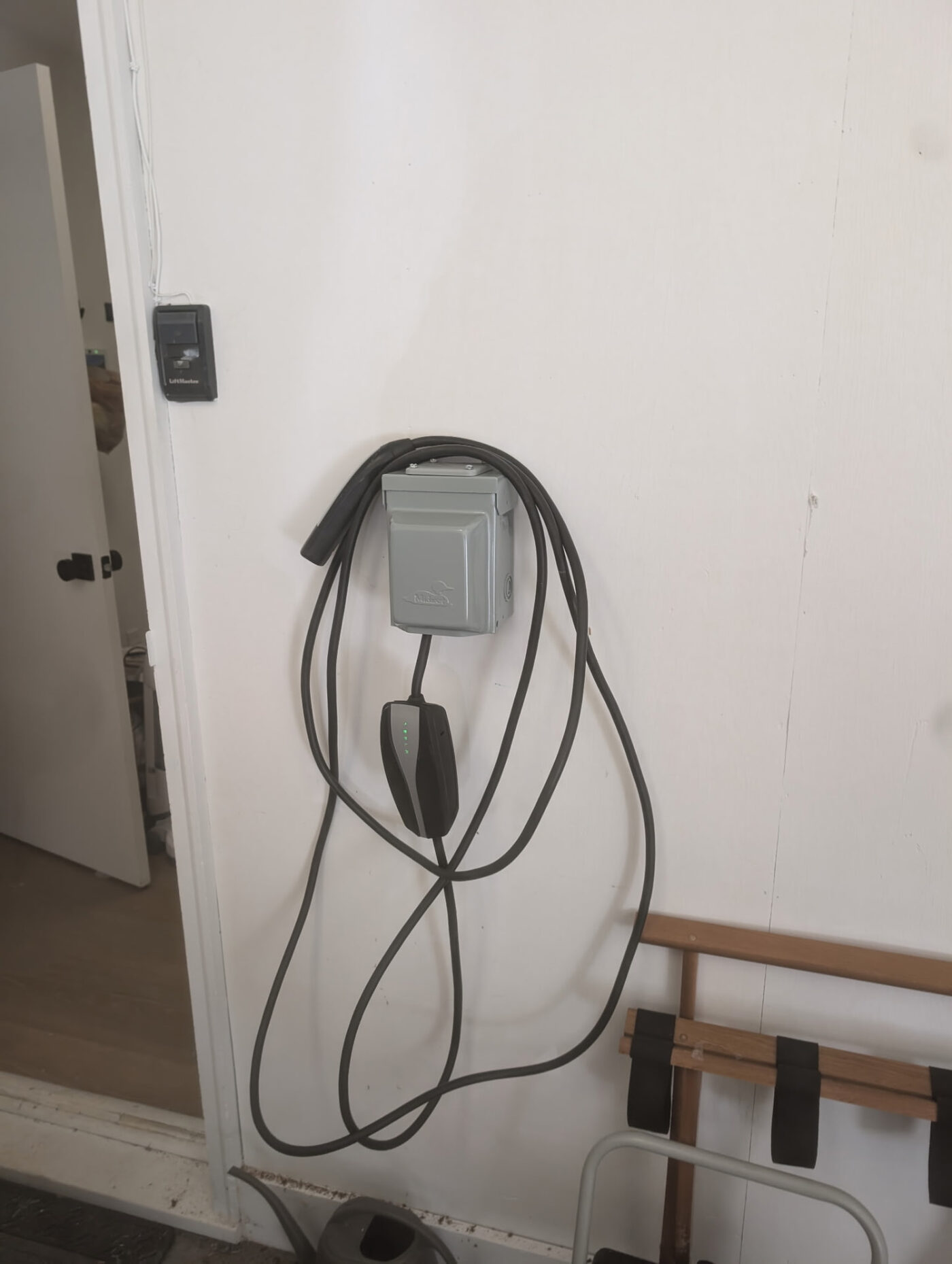 Garage charger hookup with weatherproof disconnect box